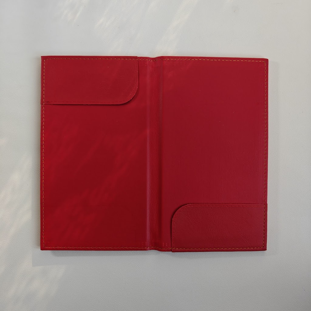Open red bill presenter interior with a single diagonal corner pocket
