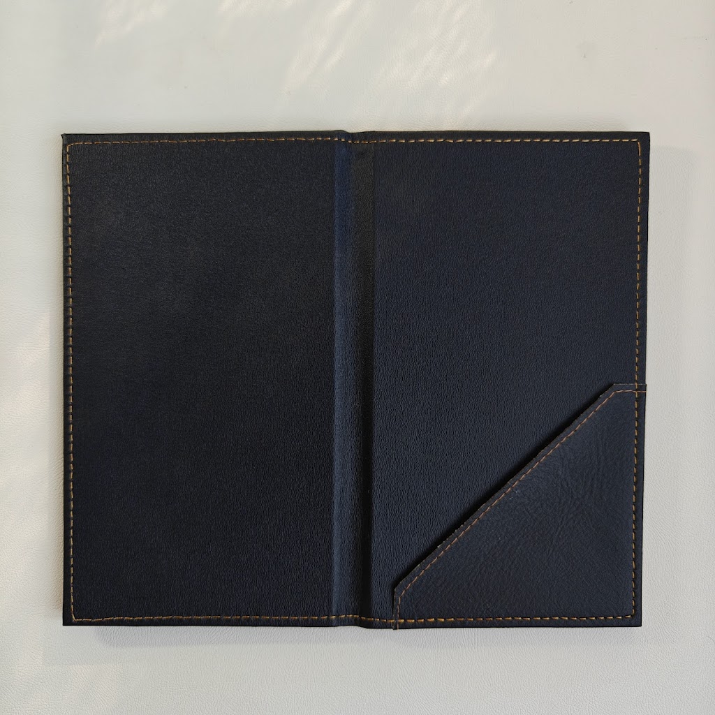 Open black bill presenter interior with a single diagonal corner pocket