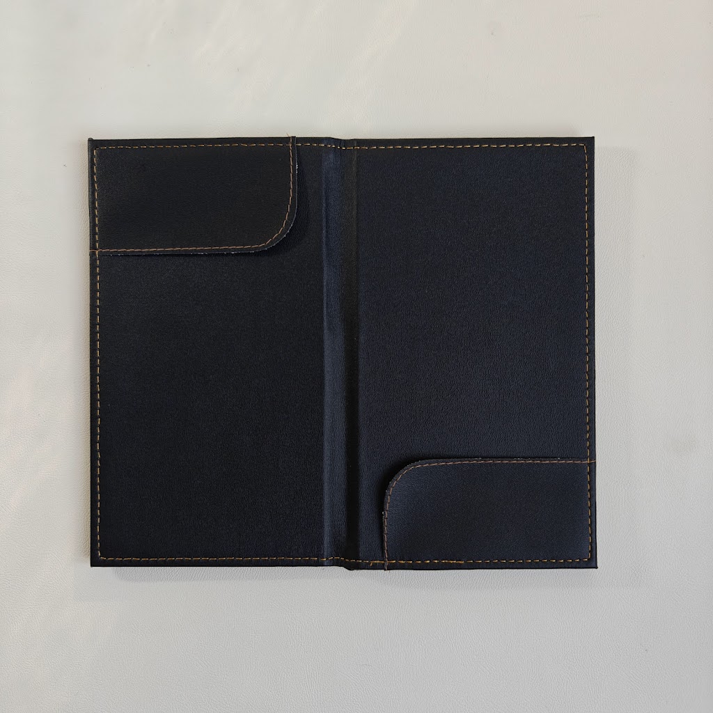 Open black bill presenter interior with two corner pockets