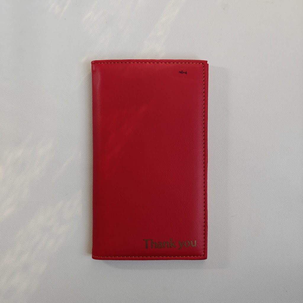 Front of the red bill presenter with embossing