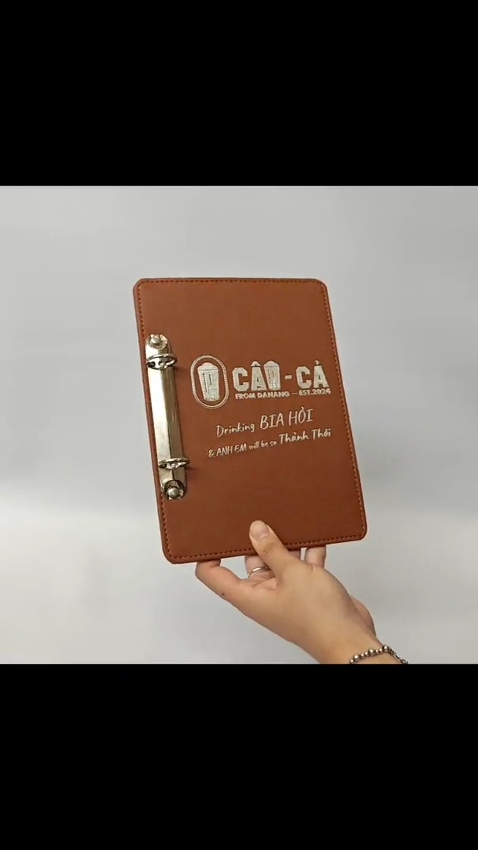 Video of the A5 leather menu cover showing texture and opening