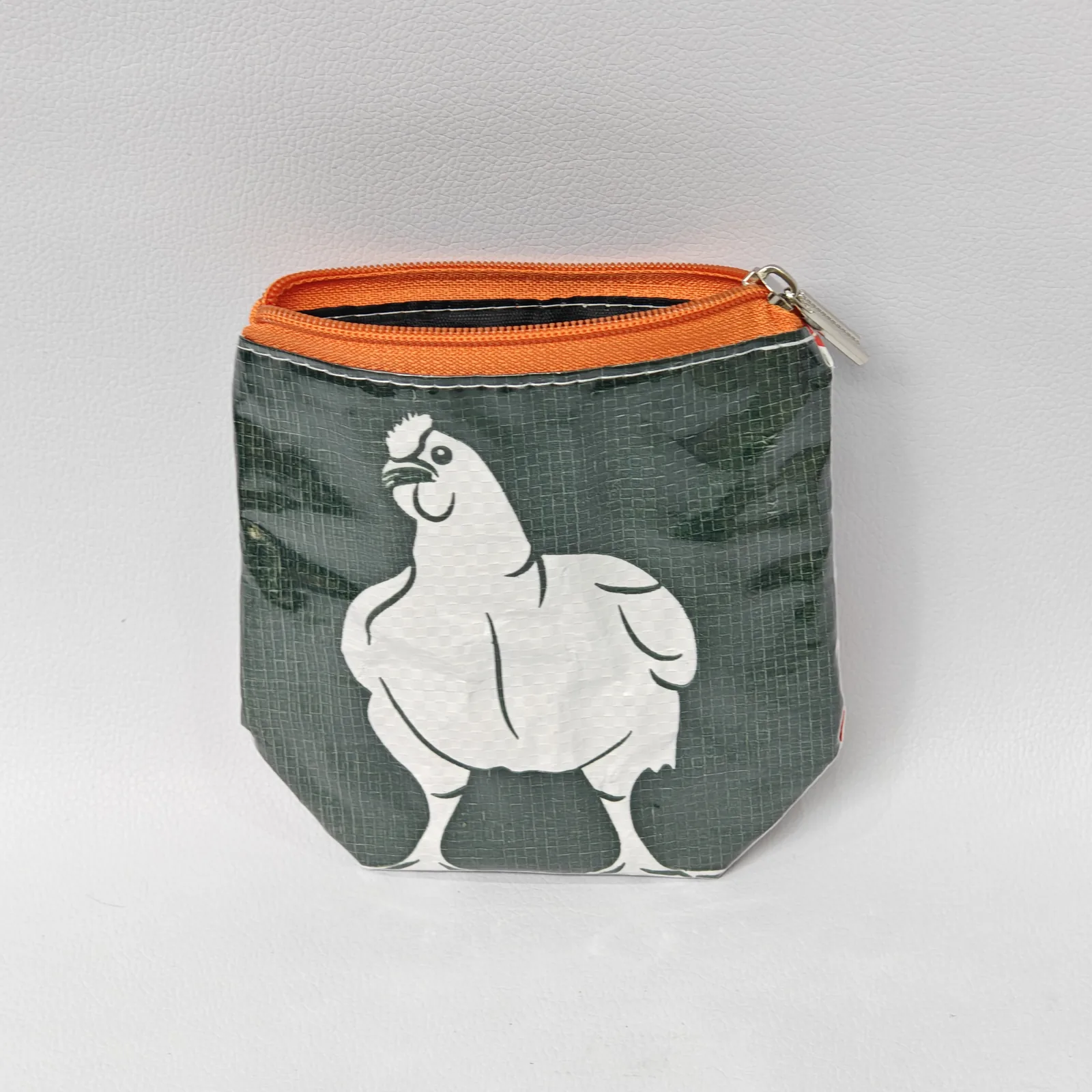 Forest green chicken-print canvas pouch with orange zipper trim