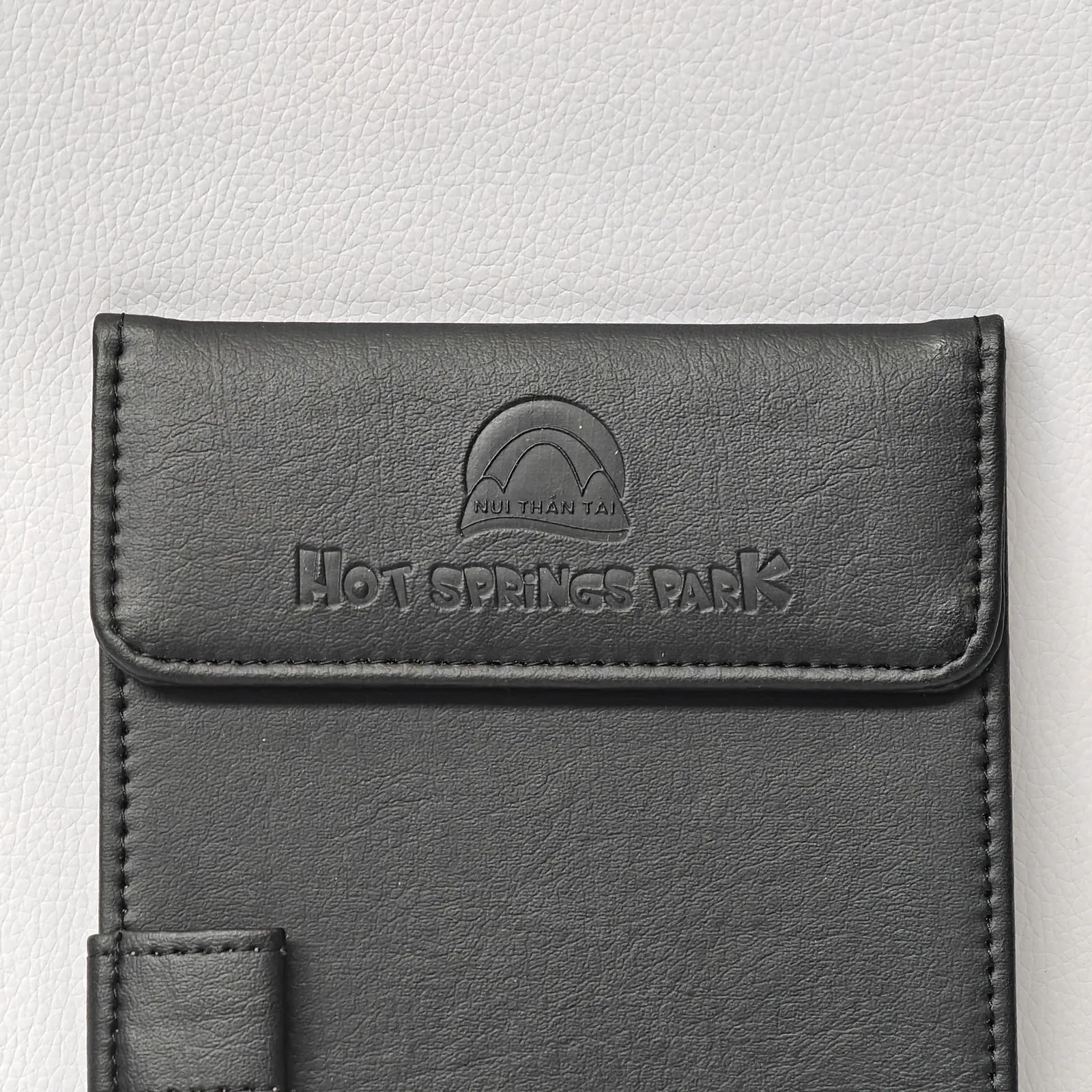 Opened bifold bill presenter showing interior pocket structure