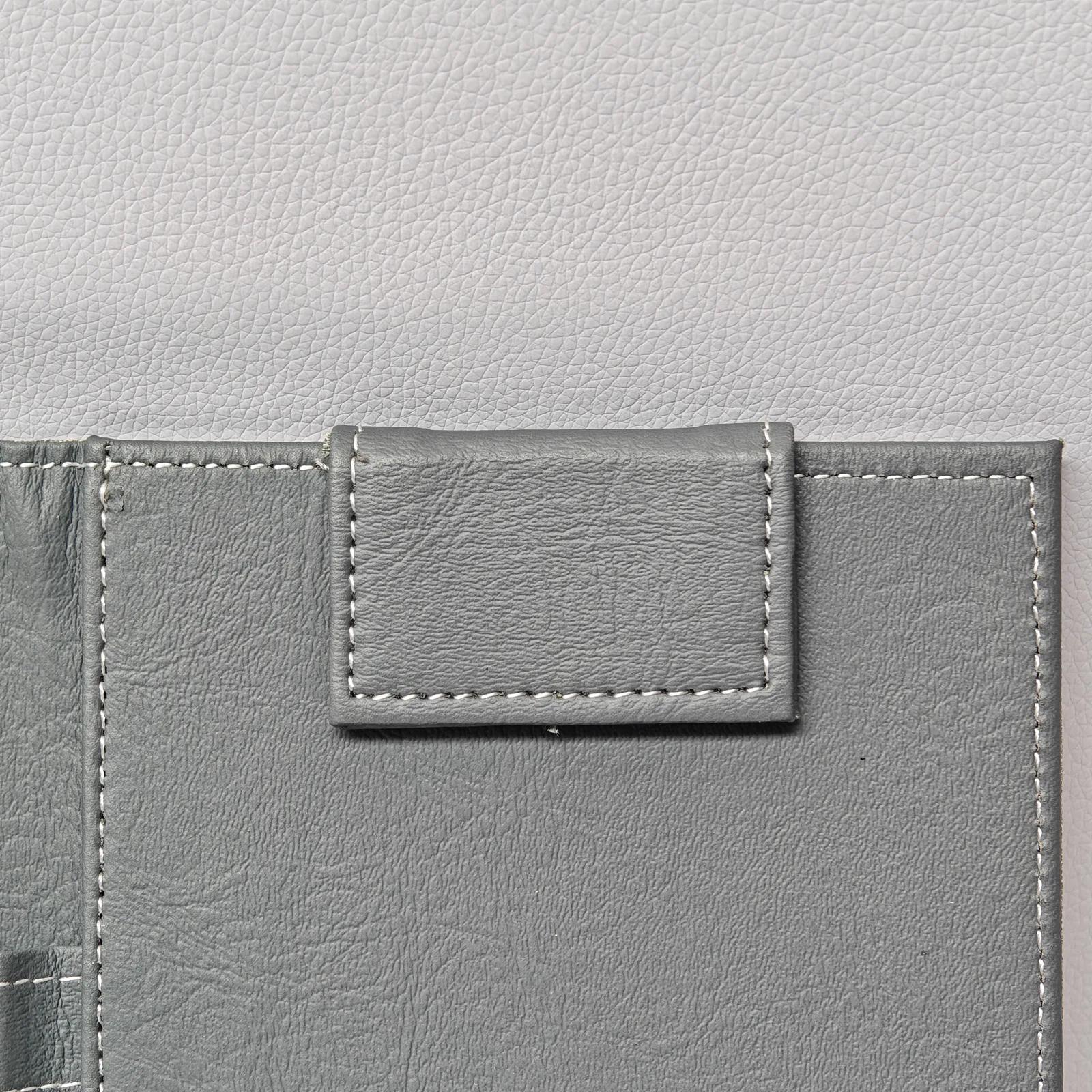 Interior pocket detail with embossed design elements