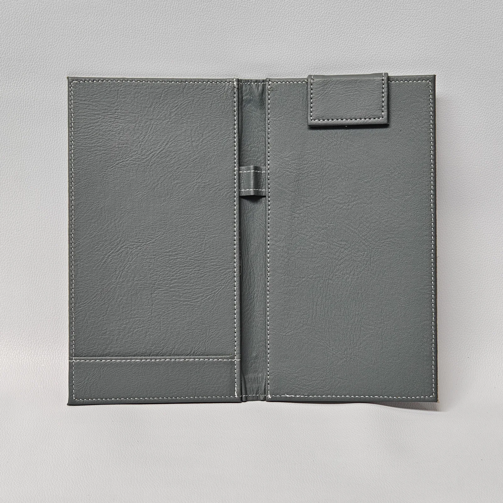 Interior view showing two leather panels and pen holder slot