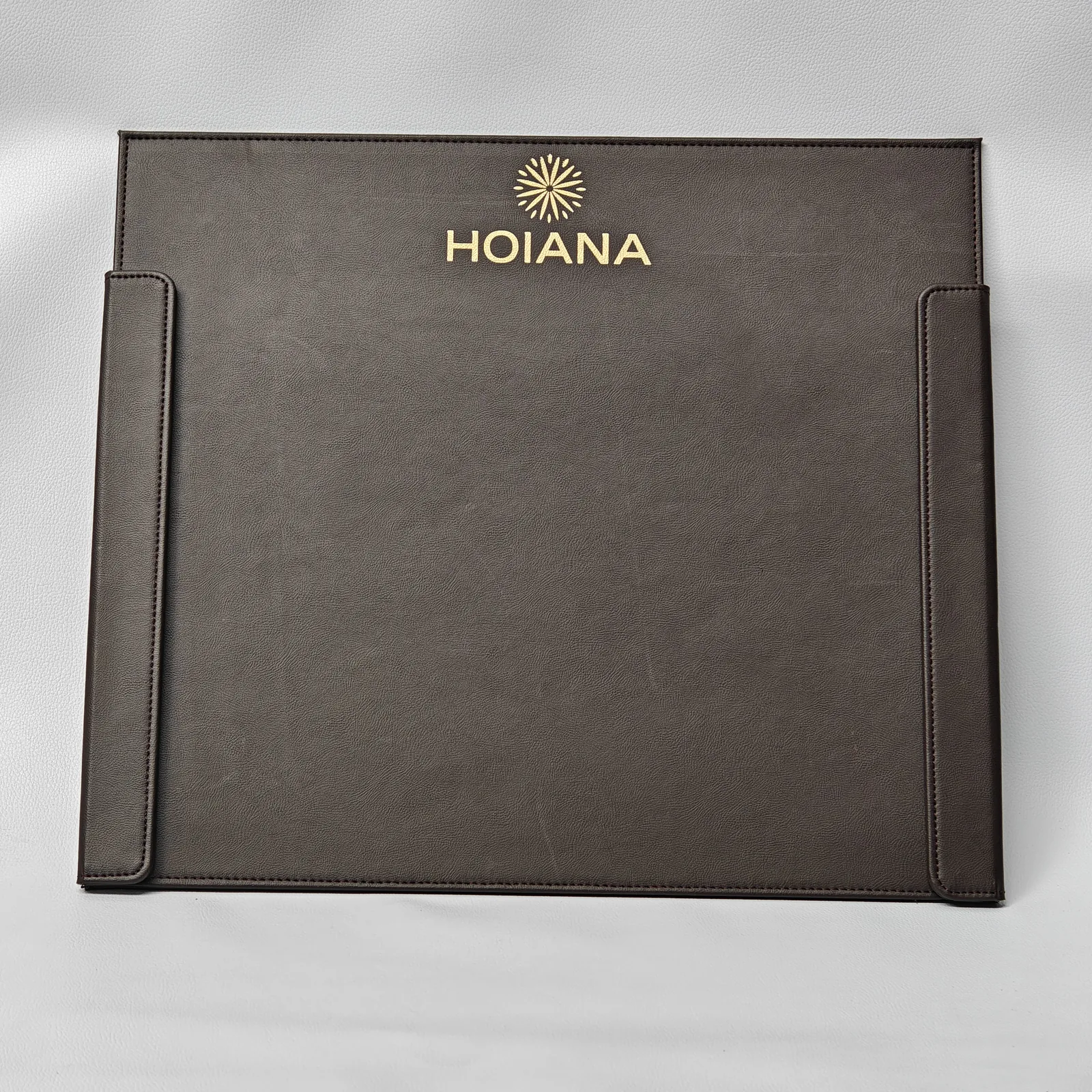 Open menu cover displaying full interior and handle placement