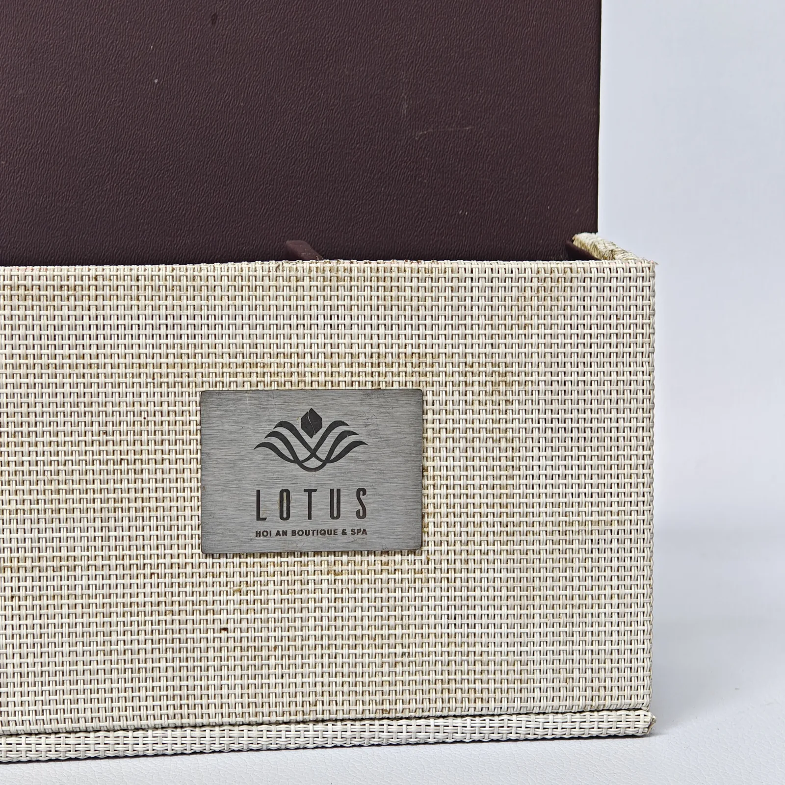 Metal nameplate detail with embossed restaurant branding