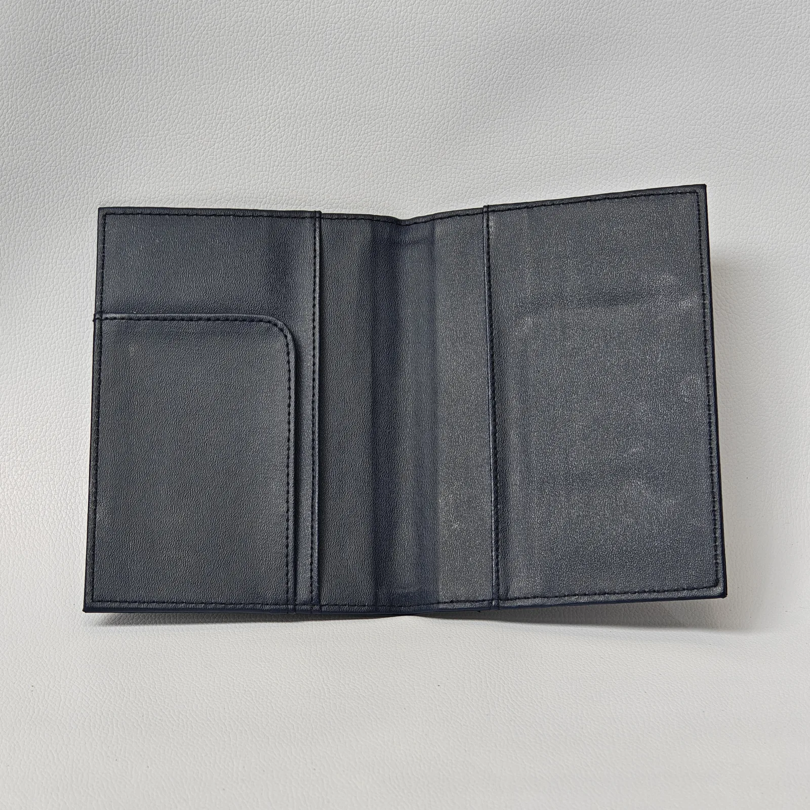 Opened interior showing three panels for bill and document presentation