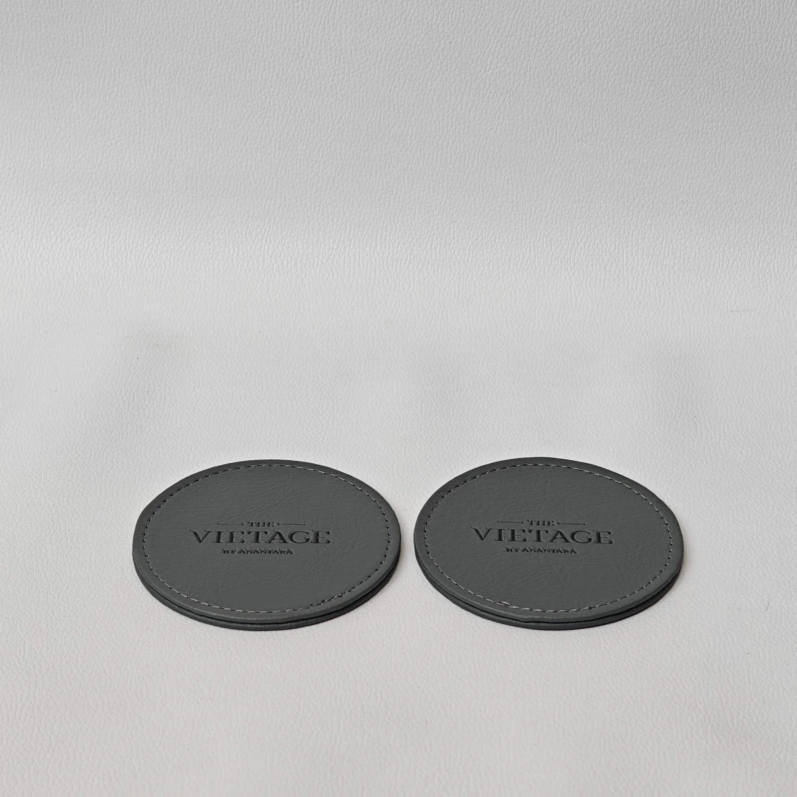 Detailed view of leather coaster set showing embossing and craftsmanship