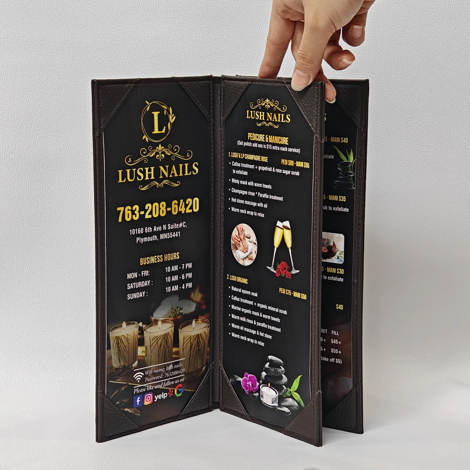 Open brochure displaying services, pricing, hours and salon imagery on interior panels