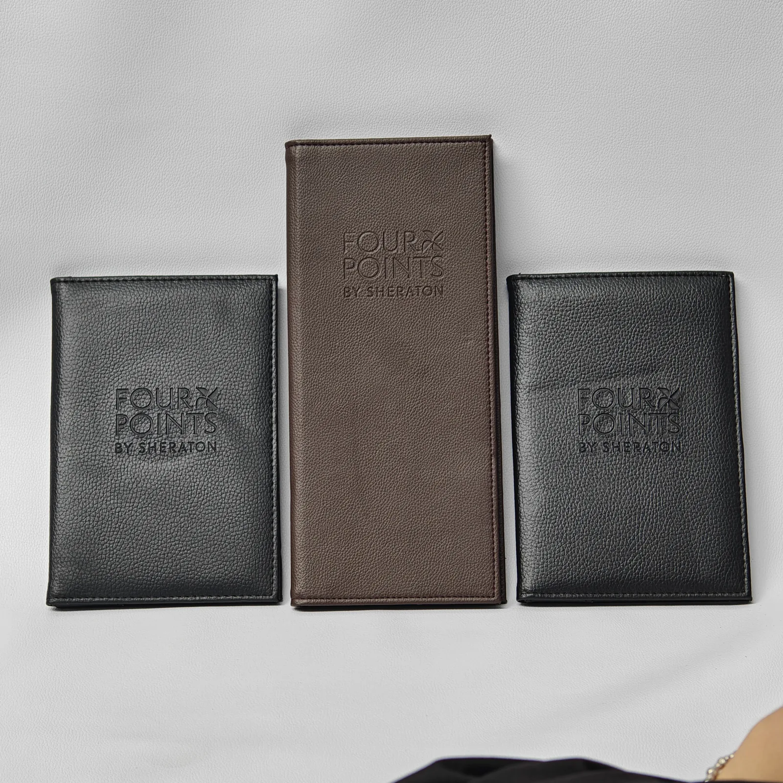 Collection of presenters showing black and taupe color variants side-by-side