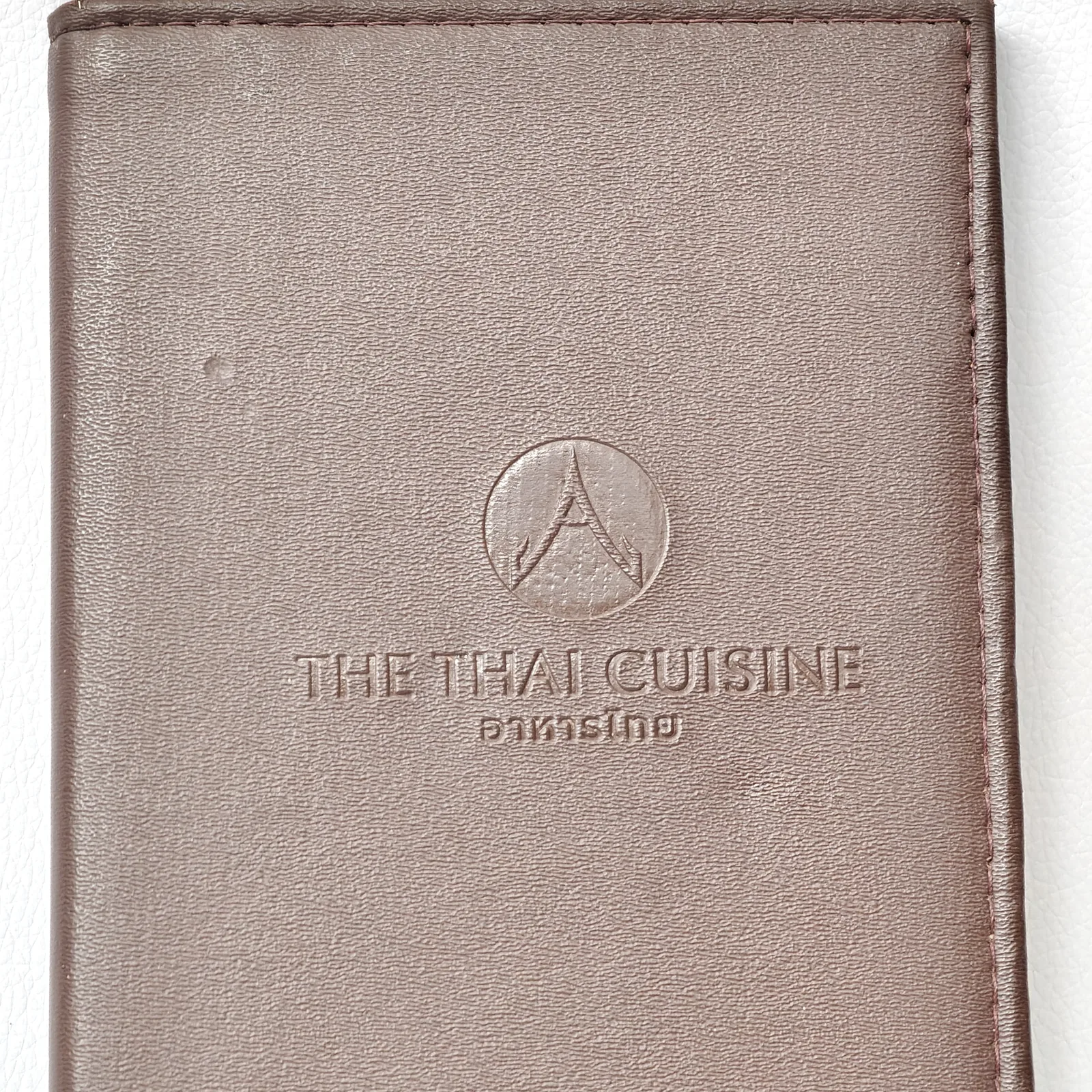 Detail view of embossed leather texture and branding